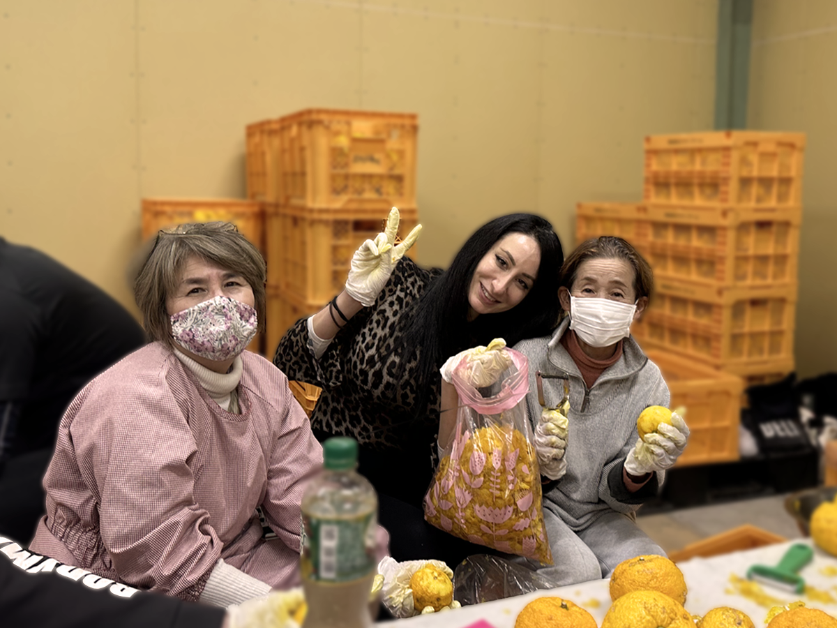 Hand-peeling yuzu by local community members